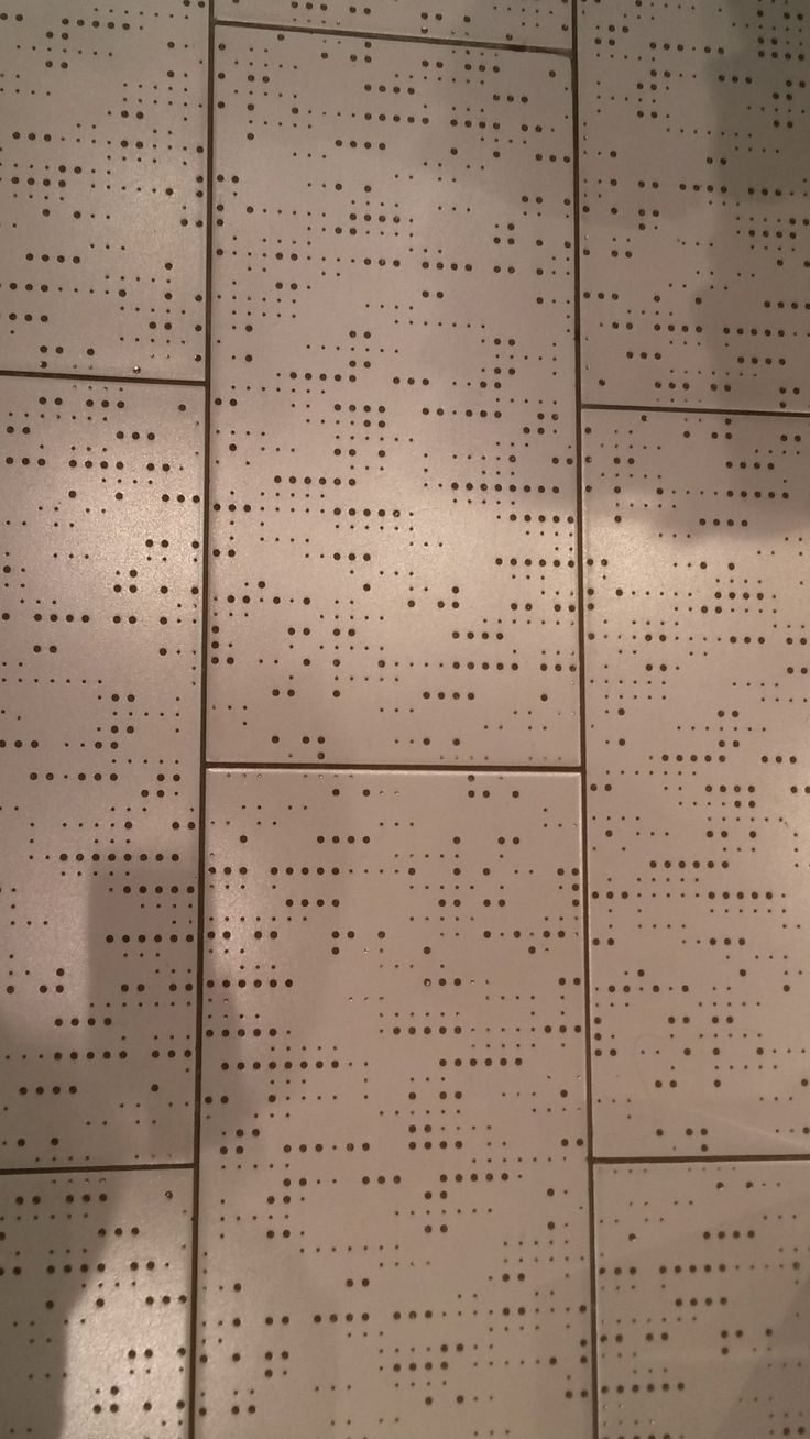 Perforated dotted panel cladding installed to a consistent joint pattern